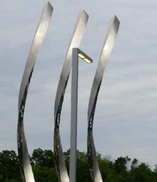 Light Fixture In Front Of Sculpture