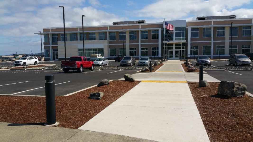 Office Parking Lot With Luminaires and American Flag