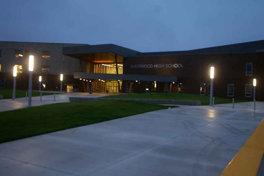 High School Entryway At Night With Lit Columns